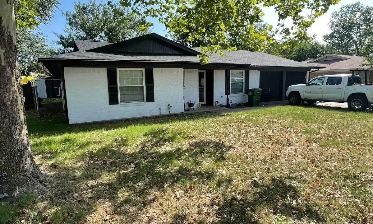 Professional roofing crew working on a residential roof in Rio Rico
